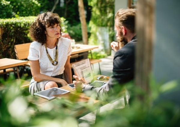 man and woman sitting in front of each other