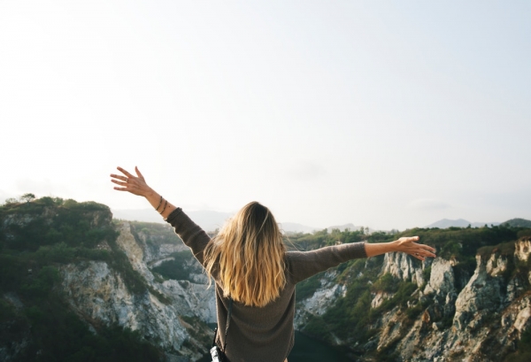 photo of person raising hands