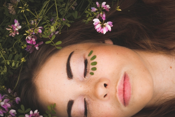 woman sleeping with pink flowers