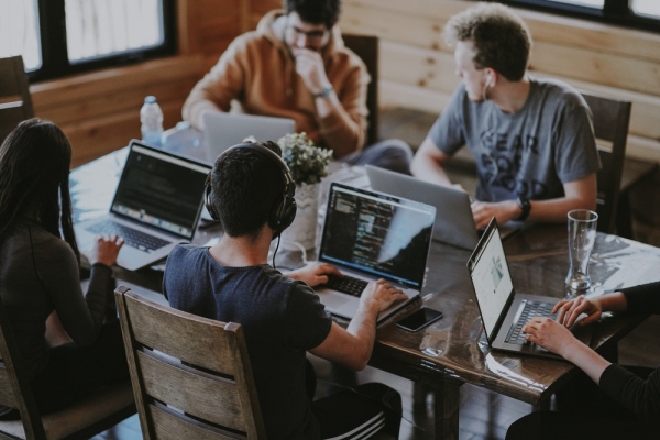 group of people using laptop computer